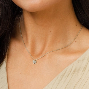 Elegant S925 sterling silver butterfly pendant necklace with sparkling zircon on a model