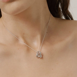 Elegant S925 sterling silver interlocking triple ring pendant necklace on female model