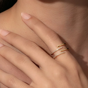 Elegant gold double-layer spiral S925 silver ring with sparkling cubic zirconia on finger