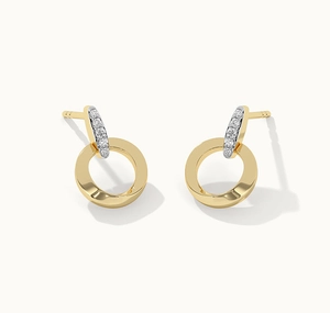 Close-up of gold round earrings with pave diamond accents and polished metallic finish