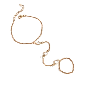 Bracciale ad anello dorato con tre cristalli rotondi e chiusura a moschettone regolabile