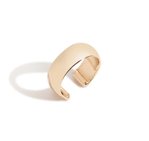 Close-up of polished gold wide band ear cuff with a smooth minimalist open-ring design