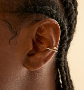 Close-up of double-layered ear cuff with sunburst element and micro-pave zircons