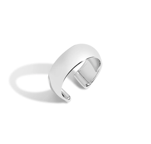 Macro shot of polished silver C-shaped cuff ring with wide rounded adjustable surface