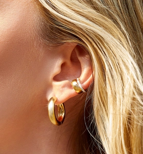 Detail of 925 sterling silver ear cuff and chunky hoop with sparkling cubic zirconia pavé