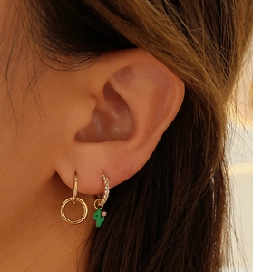 Close-up of S925 sterling silver earrings with green enamel cactus and diamond accents
