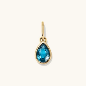 Elegant gold pear-shaped pendant with a faceted deep blue gemstone water drop design