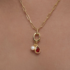 Polished gold paperclip chain necklace with a red waterdrop gemstone and white pearl