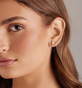 Close-up of pear-cut halo silver stud earrings featuring sparkling cubic zirconia stones