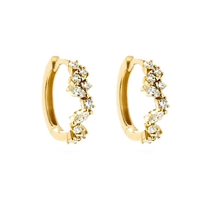 Macro detail of S925 silver gold earrings with marquise-cut sparkling zirconia stones