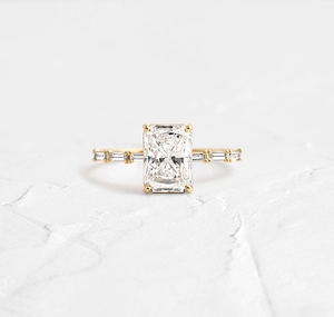 Macro detail of gold plated S925 silver ring featuring a large radiant cut zircon stone