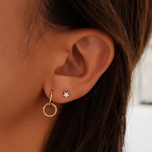 Elegant gold S925 silver earring set featuring sparkling cubic zirconia and a white star stud
