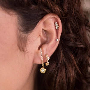 S925 sterling silver gold ear cuff set with sparkling zircons on model ear