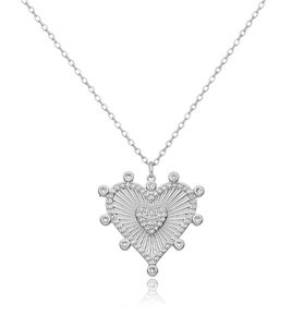Detailed macro view of S925 silver heart pendant with shimmering cubic zirconia stones