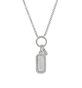 Macro detail of silver rectangle dog-tag pendant with pavé set cubic zirconia stones