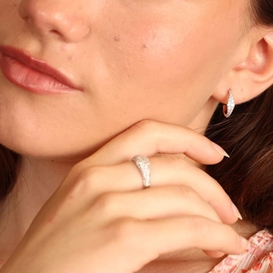 S925 sterling silver jewelry set featuring pavé cubic zirconia ring and earrings on model
