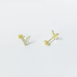 Macro detail of gold butterfly stud earrings with white enamel wings and back view