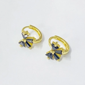 Elegant gold hoop earrings featuring black crystal bow design on a white background