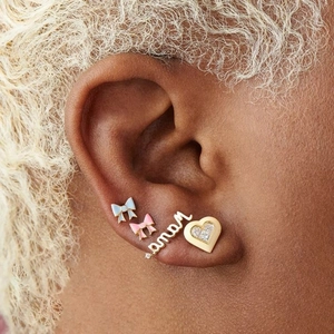 Chic S925 silver bow stud earrings with enamel details and heart crystal accents