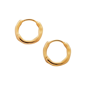 Pair of gold hoop earrings featuring irregular wave texture and polished finish on white background