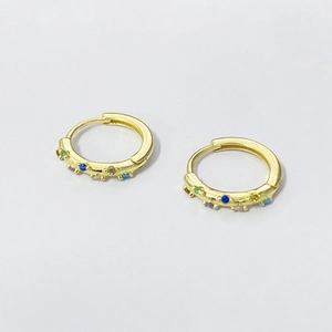 Elegant gold hoop earrings with multi-color zircon stones on white background