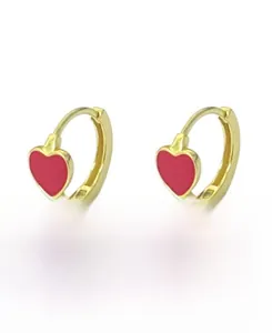 Macro detail of S925 sterling silver gold-plated hoop earrings with red enamel hearts