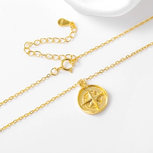 Golden S925 sterling silver compass pendant necklace with adjustable chain on white silk