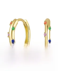 Detail of S925 sterling silver huggie earrings with colorful zirconia stones and S925 hallmark