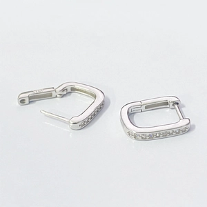 Detailed macro view of S925 sterling silver square hoop earrings with inlaid clear zircons