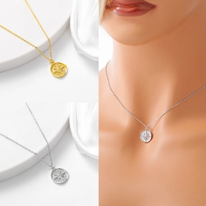 Detailed view of S925 silver compass pendant necklace in gold and silver finishes