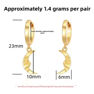 Close-up of S925 sterling silver gold crescent moon earrings with relief face detail