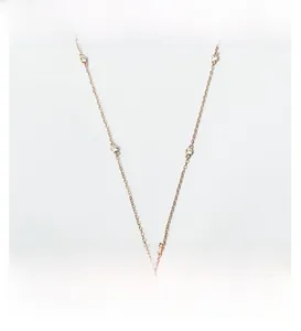 Detailed view of rose gold Evil Eye pendant necklace with pavé crystal accents