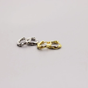 Detailed view of handmade S925 sterling silver hoop earrings with a lava texture finish