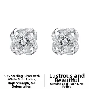 Macro detail of S925 sterling silver cross knot earrings with sparkling cubic zirconia