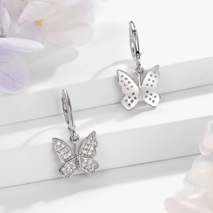 Detail of S925 sterling silver butterfly earrings with sparkling cubic zirconia inlay
