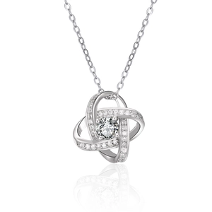 Macro detail of S925 sterling silver interlaced pendant with sparkling cubic zirconia stone