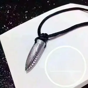 Detailed close-up of S925 sterling silver bullet pendant with unique textured finish