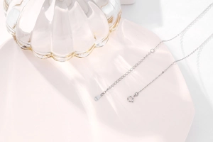 Detail of 925 sterling silver chain with lobster clasp and adjustable extension tag