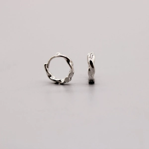Minimalist S925 sterling silver huggie earrings with irregular textured twist design