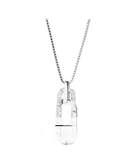 Close-up of interlocking double ring pendant with pavé crystals and engraved silver box chain
