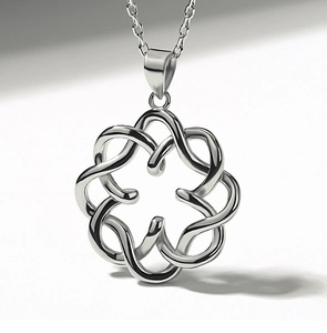 Macro shot of polished silver Celtic knot pendant with intricate openwork on O-chain