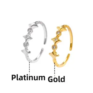 Detail of adjustable star rings with cubic zirconia in gold and silver plating
