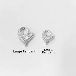 Close-up of S925 silver heart pendants in large and small sizes with white stones