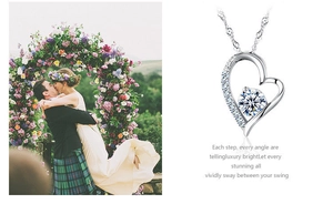 Detail of S925 silver heart pendant with white and purple sparkling cubic zirconia