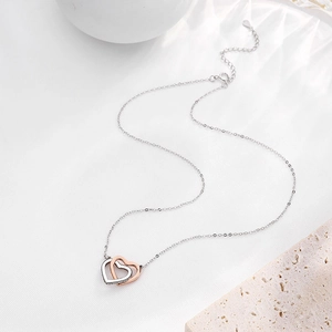 Elegant s925 silver double heart necklace with interlocking silver and rose gold hearts
