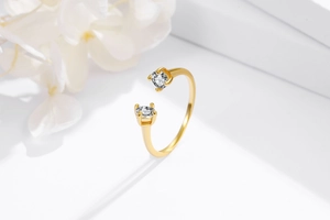 Detail of gold S925 sterling silver open ring with dual round zircon gemstones