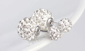 Close-up of S925 sterling silver double-sided stud earrings with crystal pave ball detail