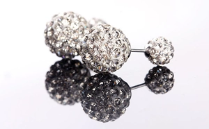 Detail of 925 sterling silver Shamballa double stud earrings with shimmering crystals