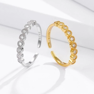 Macro detail of gold and silver S925 rings with cubic zirconia and S925 engraving