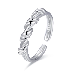 Macro detail of knot design on S925 sterling silver ring showing the inner material stamp